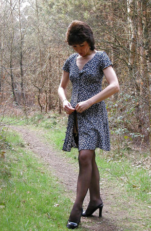Amateur mature lady takes a walk in the woods.